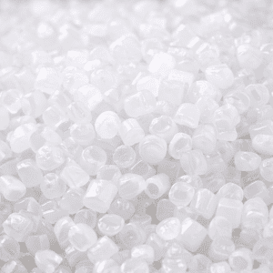 Close-up of white HDPE HBM 5510 resin pellets, showing uniform cylindrical shape, texture, and high-quality material for industrial blow molding applications.