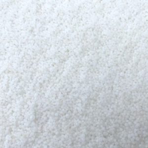 Agricultural prilled urea 46% nitrogen fertilizer granules close-up view